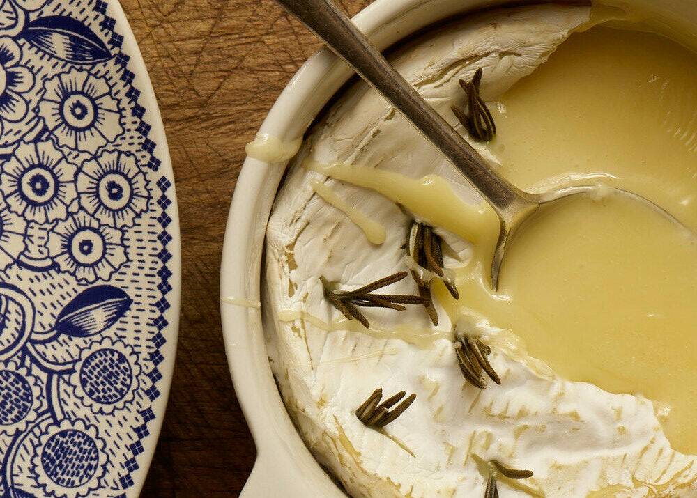 baked cheese with spoon